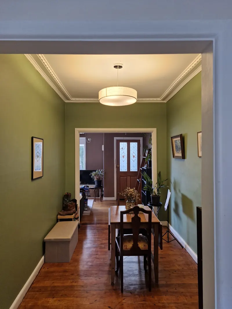 Period home hallway with a drum pendant light