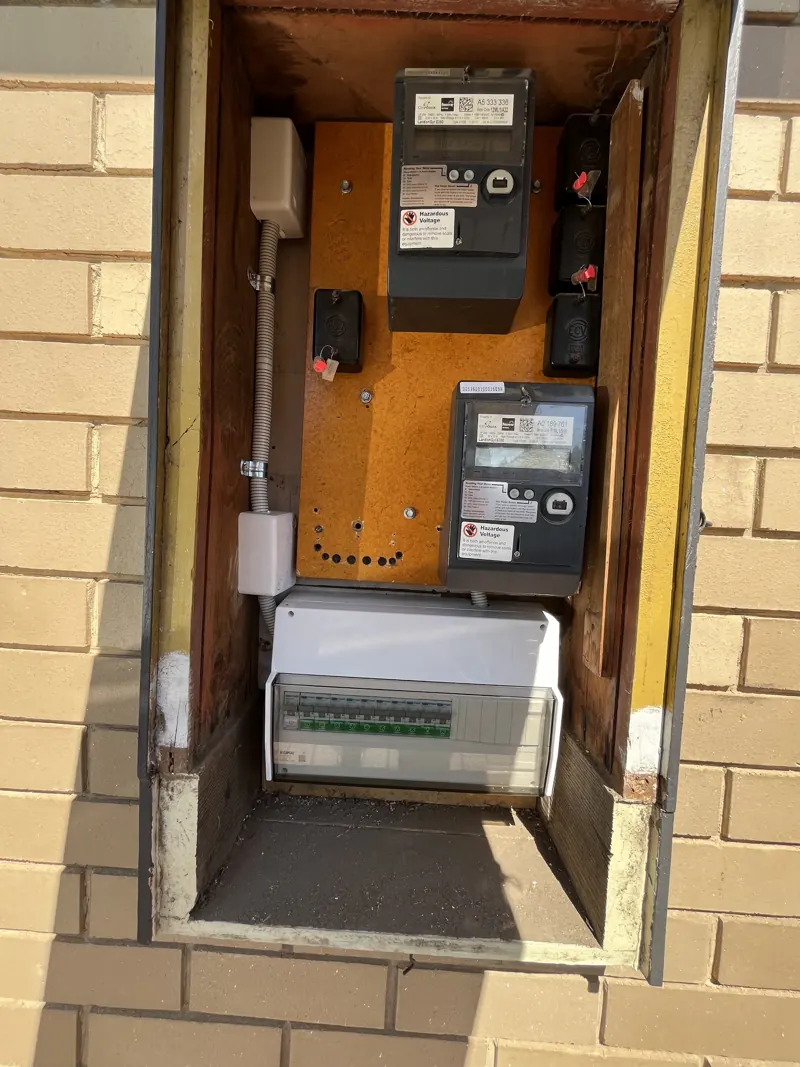 Old switchboard and meter panel before an upgrade